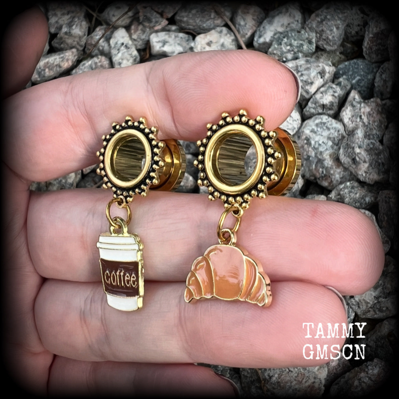 These adorable tunnel earrings feature a cup of coffee and a cute croissant, weighing approx 5 grams each, and measuring just under 4cms from tip to tip.

This pair has been made with 00 gauge (10mm) surgical steel ornate screw fit tunnels-suitable for pierced ears.