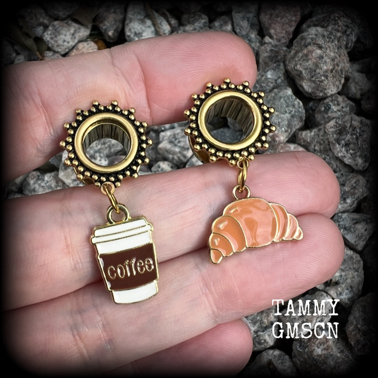 These adorable tunnel earrings feature a cup of coffee and a cute croissant, weighing approx 5 grams each, and measuring just under 4cms from tip to tip.

This pair has been made with 00 gauge (10mm) surgical steel ornate screw fit tunnels-suitable for pierced ears.