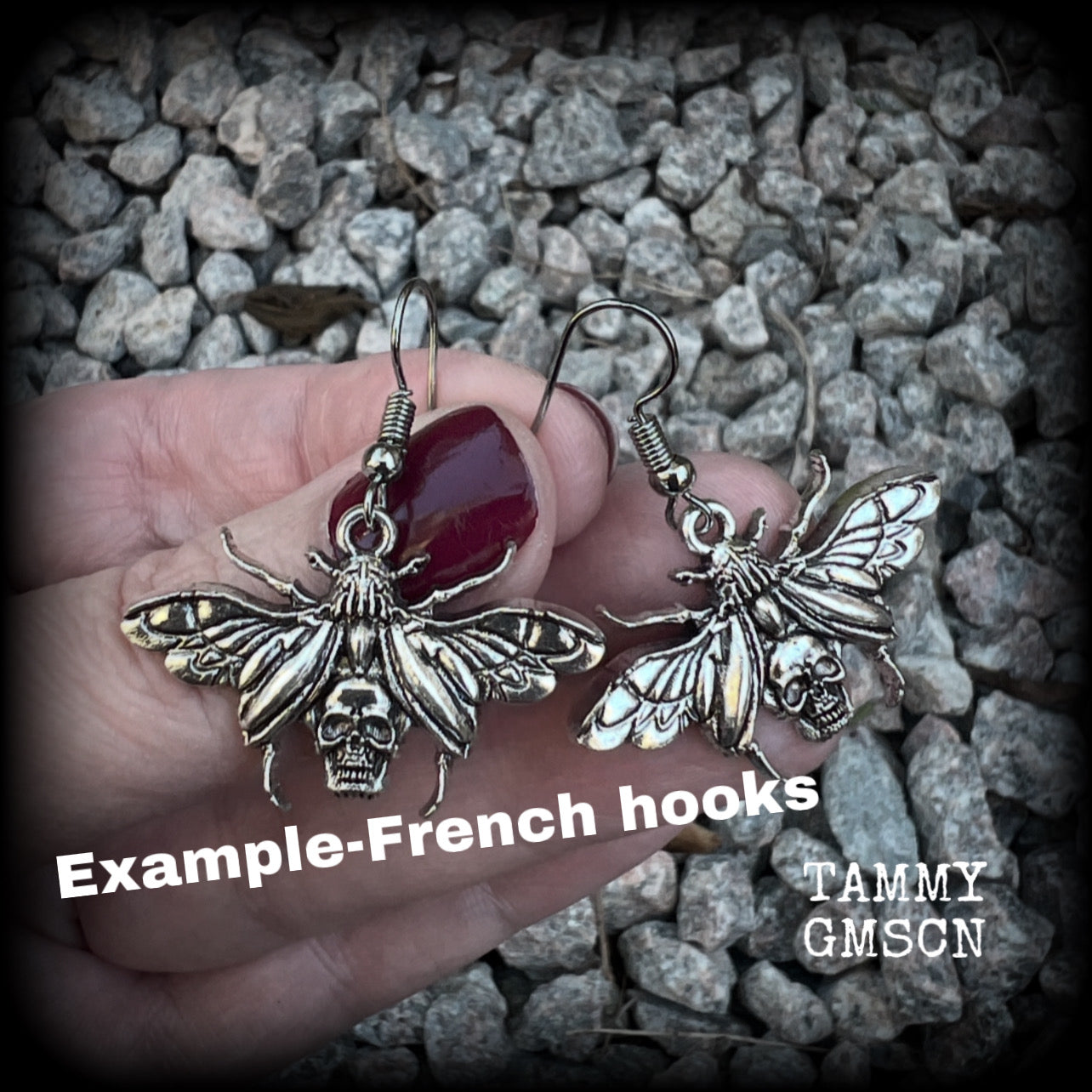 These awesome earrings feature antique silver scarab beetles with wings open revealing a skull on its body, measuring just under 4cms, and weighing only a few grams each.

This pair has been made on stainless steel french hooks, for pierced ears.