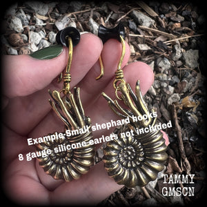 These gorgeous brass nautilus earrings weigh approx. 24 grams each and measure just over 6cms from tip to tip.
This pair have been made with small antique gold shephard hooks, suitable for stretched ears.