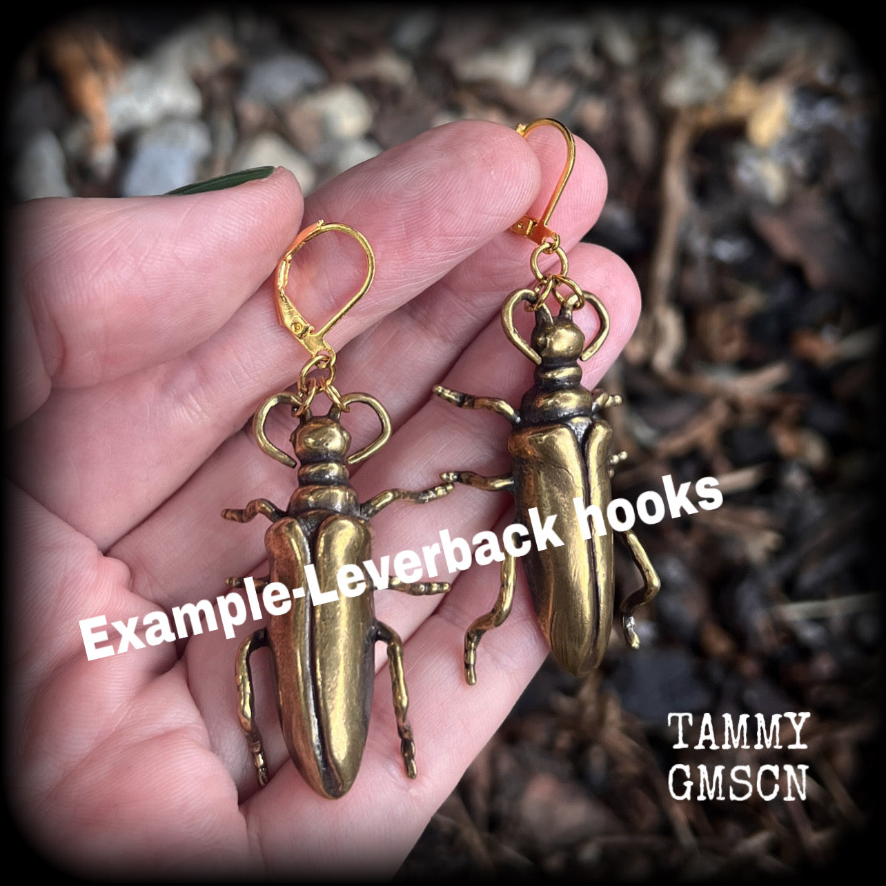 These awesome brass beetle earrings weigh approx. 15 grams each and measure just under 7cms from tip to tip.
This pair have been made with antique gold leverback hooks, suitable for pierced ears.