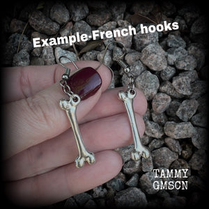 These awesome earrings feature classic antique silver bones, measuring 6cms from tip to tip, nice and dangly, and are nice and light weight at 4 grams each.

This pair has been made on stainless steel french hooks to be worn through pierced ears.