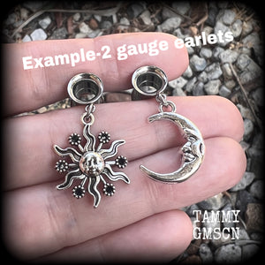 These gorgeous folk horror inspired tunnels feature antique silver crescent moon and esoteric sun charms, are super light weight at just 5 grams each and measure just over 4 cms from tip to tip.

This pair has been made with 2 gauge (6mm) surgical steel screw fit earlets-for stretched lobes.