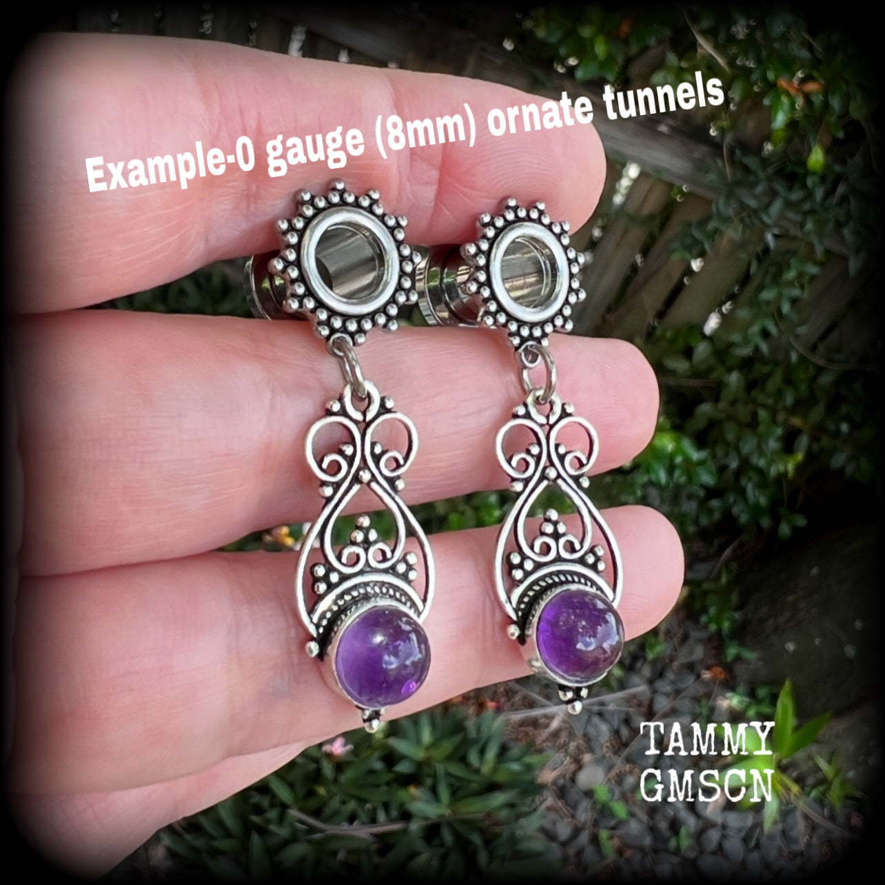 These beautiful boho tunnel earrings feature gorgeous polished amethyst gemstones, weighing approx 5 grams each and measure just under 5cms from tip to tip.

This pair has been made with 0 gauge (8mm) ornate surgical steel screw fit tunnels.

