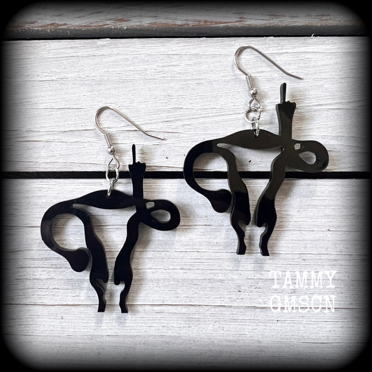 Angry uterus earrings 