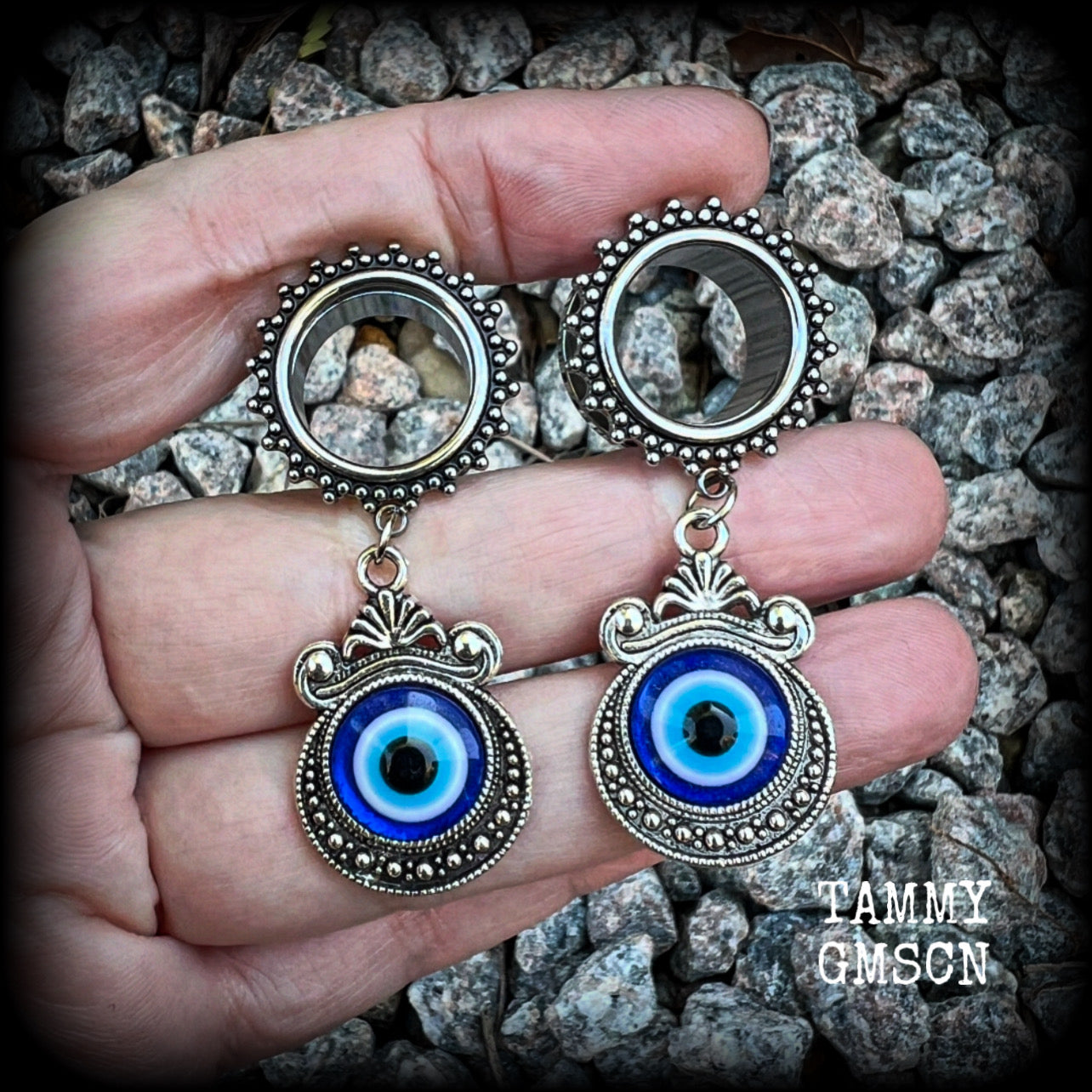 These stunning tunnel earrings feature gorgeous ornate blue and white enamel and antique silver turkish evil eye charms, are nice and lightweight, weighing approx 10 grams each, measuring approx 5.5cms from tip to tip.

This pair has been made on 5/8” (16mm) gauge ornate surgical steel screw fit tunnels.