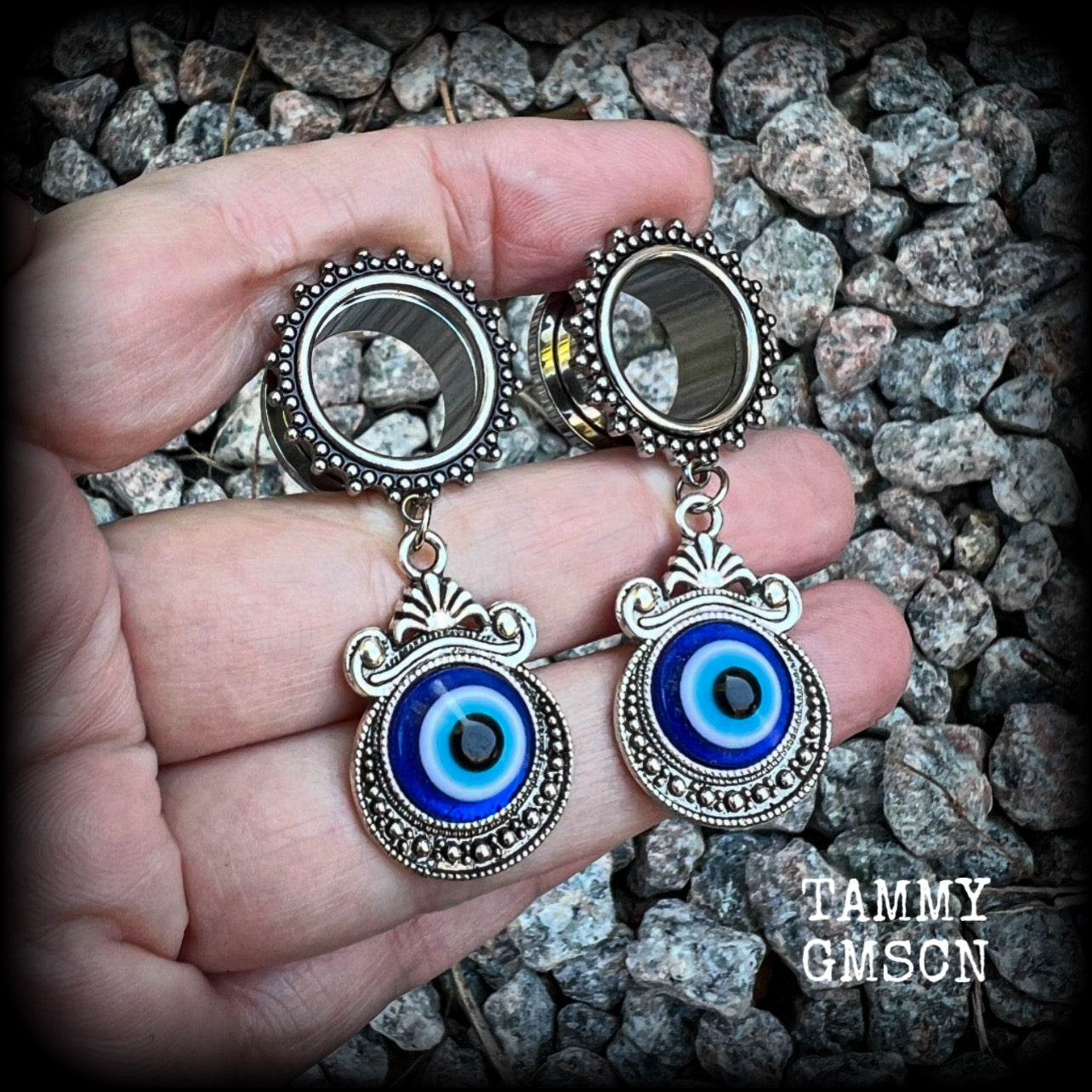These stunning tunnel earrings feature gorgeous ornate blue and white enamel and antique silver turkish evil eye charms, are nice and lightweight, weighing approx 10 grams each, measuring approx 5.5cms from tip to tip.

This pair has been made on 5/8” (16mm) gauge ornate surgical steel screw fit tunnels.