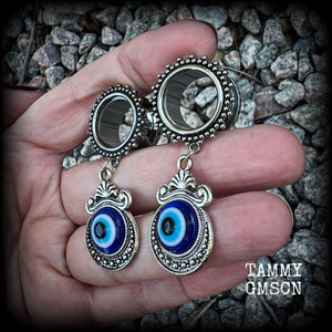 These stunning tunnel earrings feature gorgeous ornate blue and white enamel and antique silver turkish evil eye charms, are nice and lightweight, weighing approx 10 grams each, measuring approx 5.5cms from tip to tip.

This pair has been made on 5/8” (16mm) gauge ornate surgical steel screw fit tunnels.