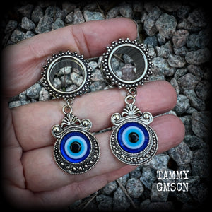 These stunning tunnel earrings feature gorgeous ornate blue and white enamel and antique silver turkish evil eye charms, are nice and lightweight, weighing approx 10 grams each, measuring approx 5.5cms from tip to tip.

This pair has been made on 5/8” (16mm) gauge ornate surgical steel screw fit tunnels.