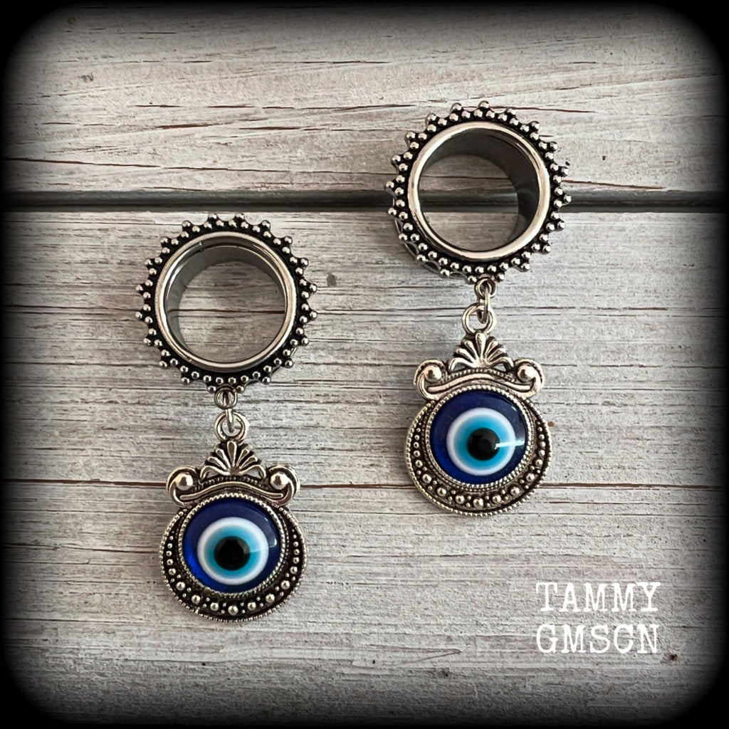 These stunning tunnel earrings feature gorgeous ornate blue and white enamel and antique silver turkish evil eye charms, are nice and lightweight, weighing approx 10 grams each, measuring approx 5.5cms from tip to tip.

This pair has been made on 5/8” (16mm) gauge ornate surgical steel screw fit tunnels.