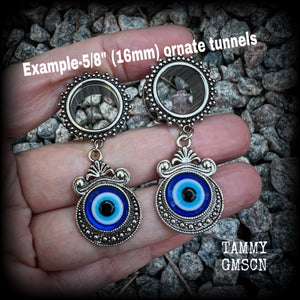 These stunning tunnel earrings feature gorgeous ornate blue and white enamel and antique silver turkish evil eye charms, are nice and lightweight, weighing approx 10 grams each, measuring approx 5.5cms from tip to tip.

This pair has been made on 5/8” (16mm) gauge ornate surgical steel screw fit tunnels.
