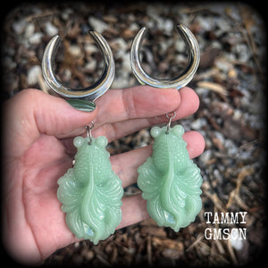 These gorgeous earrings feature carved chinese jade koi fish, weighing approx. 34 grams each and measuring just over 10cms from tip to tip.
This pair have been made on 1.18” gauge (30mm) surgical steel cradles, suitable for stretched lobes.