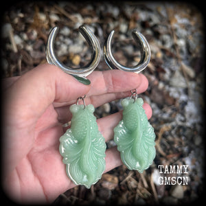 These gorgeous earrings feature carved chinese jade koi fish, weighing approx. 34 grams each and measuring just over 10cms from tip to tip.
This pair have been made on 1.18” gauge (30mm) surgical steel cradles, suitable for stretched lobes.