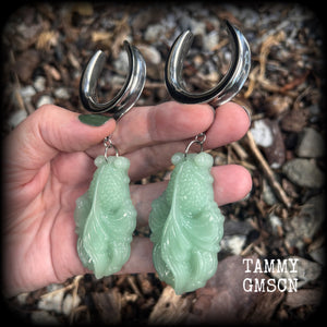 These gorgeous earrings feature carved chinese jade koi fish, weighing approx. 34 grams each and measuring just over 10cms from tip to tip.
This pair have been made on 1.18” gauge (30mm) surgical steel cradles, suitable for stretched lobes.