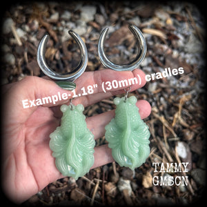 These gorgeous earrings feature carved chinese jade koi fish, weighing approx. 34 grams each and measuring just over 10cms from tip to tip.
This pair have been made on 1.18” gauge (30mm) surgical steel cradles, suitable for stretched lobes.
