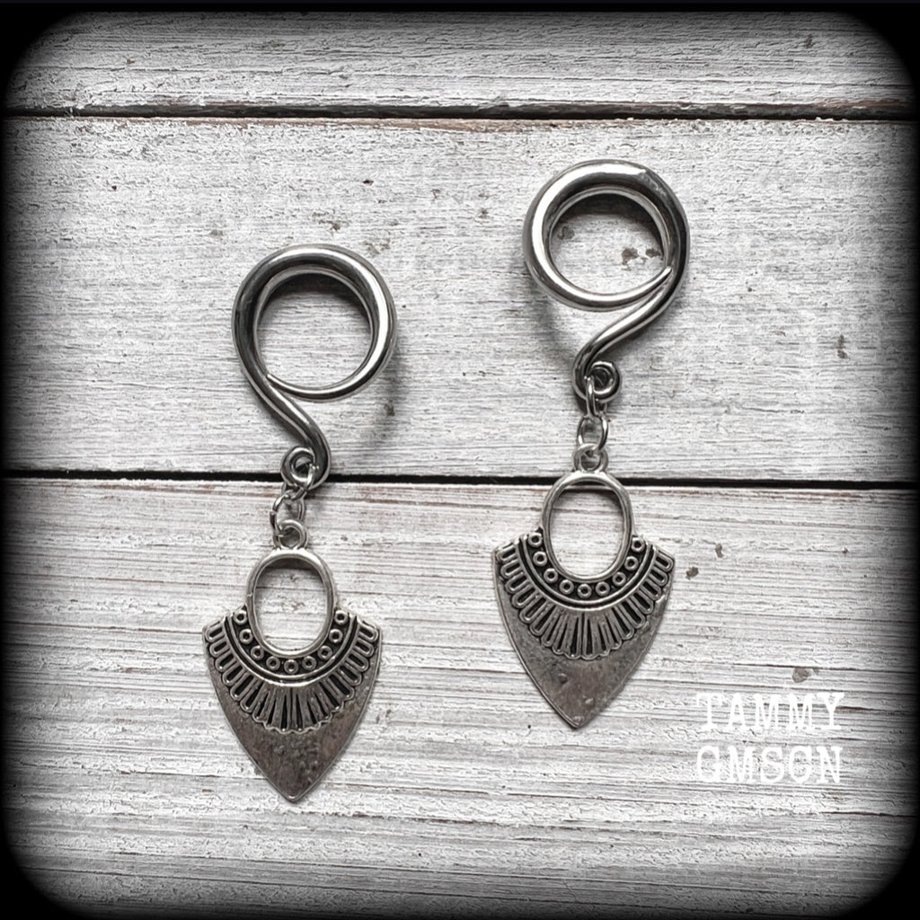 Inspired by Ishtar, Mesopotamian Goddess of love, beauty, sex and war, these beautiful tribal antique silver gauged earrings are nice and light weight, weighing approx 5 grams a piece, and are nice and dangly, measuring just on 6cms from tip to tip.
This pair has been made on 6 gauge (4mm) surgical steel full curl hooks, to be worn in stretched lobes.