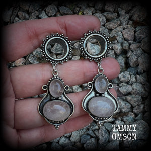 These beautiful earrings have been made with gorgeous translucent dusty pink rose quartz gemstones in a beautiful big boho antique silver setting, weighing approx 12 grams each and measure just over 6cms from tip to tip.

This pair has been made with 9/16" gauge (14mm) gauge ornate surgical steel screw fit tunnels.