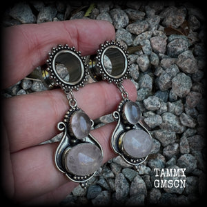 These beautiful earrings have been made with gorgeous translucent dusty pink rose quartz gemstones in a beautiful big boho antique silver setting, weighing approx 12 grams each and measure just over 6cms from tip to tip.

This pair has been made with 9/16" gauge (14mm) gauge ornate surgical steel screw fit tunnels.