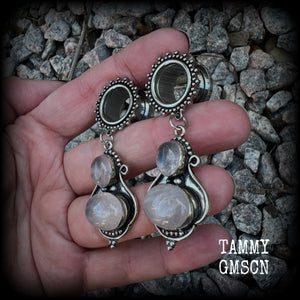 These beautiful earrings have been made with gorgeous translucent dusty pink rose quartz gemstones in a beautiful big boho antique silver setting, weighing approx 12 grams each and measure just over 6cms from tip to tip.

This pair has been made with 9/16" gauge (14mm) gauge ornate surgical steel screw fit tunnels.