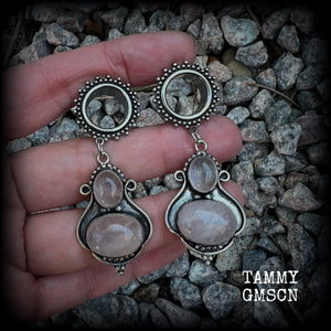 These beautiful earrings have been made with gorgeous translucent dusty pink rose quartz gemstones in a beautiful big boho antique silver setting, weighing approx 12 grams each and measure just over 6cms from tip to tip.

This pair has been made with 9/16" gauge (14mm) gauge ornate surgical steel screw fit tunnels.