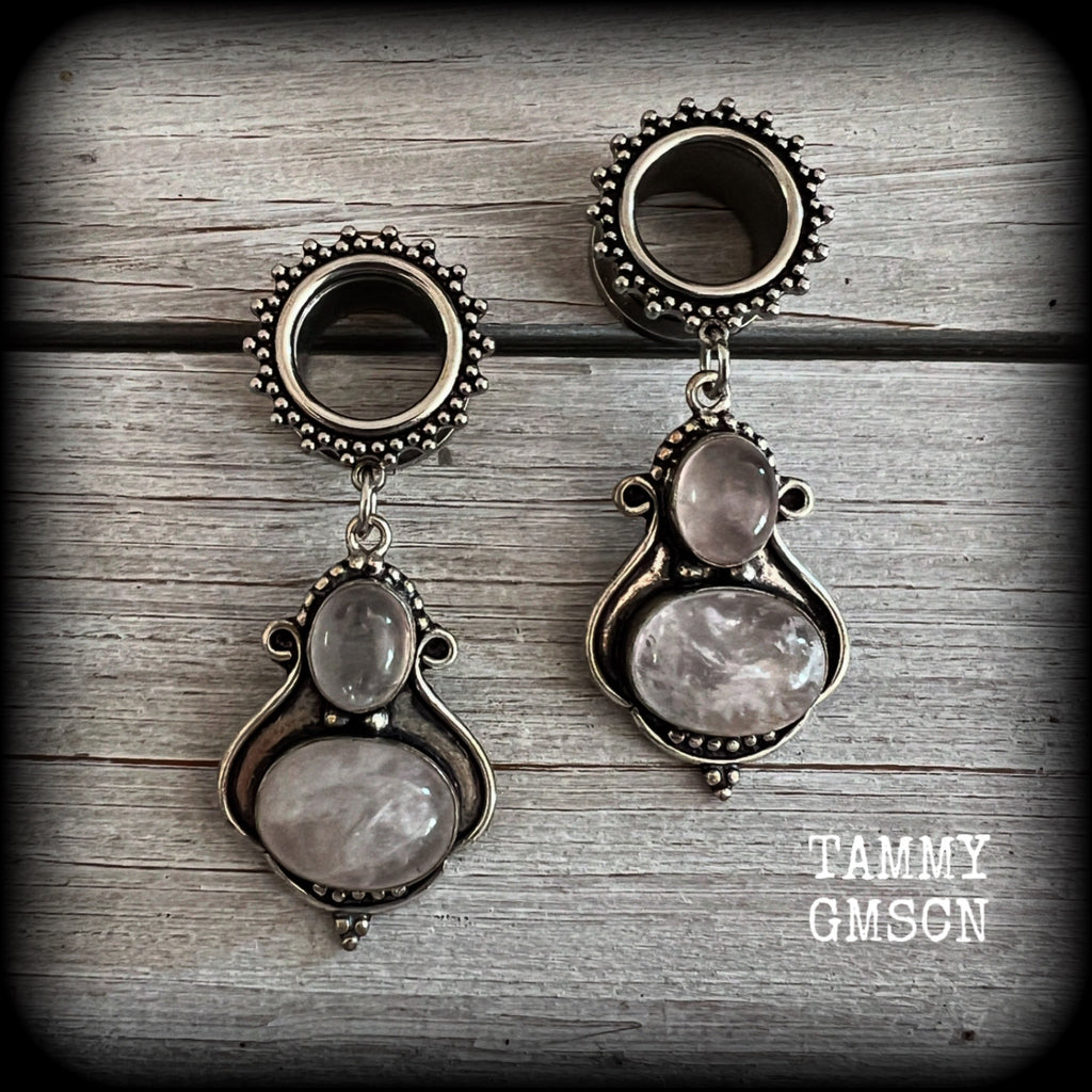 These beautiful earrings have been made with gorgeous translucent dusty pink rose quartz gemstones in a beautiful big boho antique silver setting, weighing approx 12 grams each and measure just over 6cms from tip to tip.

This pair has been made with 9/16" gauge (14mm) gauge ornate surgical steel screw fit tunnels.
