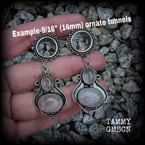 These beautiful earrings have been made with gorgeous translucent dusty pink rose quartz gemstones in a beautiful big boho antique silver setting, weighing approx 12 grams each and measure just over 6cms from tip to tip.

This pair has been made with 9/16" gauge (14mm) gauge ornate surgical steel screw fit tunnels.