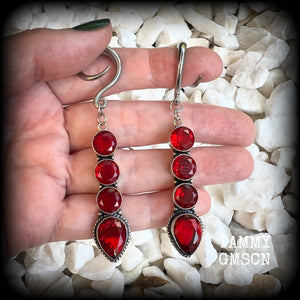 These stunning dangly gauged earrings feature gorgeous deep red faceted garnet gemstones in an ornate antique silver setting, measuring just over 8cms from tip to tip, and weigh approx 9 grams each.

This pair have been made with 6 gauge (4mm) surgical steel full curl hooks, to be worn in stretched lobes.