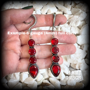 These stunning dangly gauged earrings feature gorgeous deep red faceted garnet gemstones in an ornate antique silver setting, measuring just over 8cms from tip to tip, and weigh approx 9 grams each.

This pair have been made with 6 gauge (4mm) surgical steel full curl hooks, to be worn in stretched lobes.