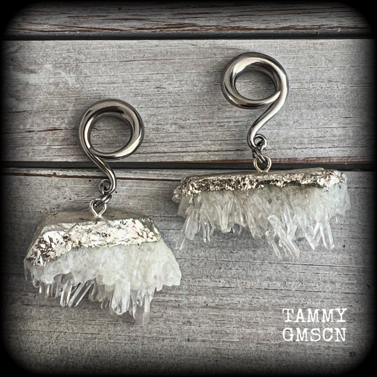 These gorgeous gauged earrings feature beautiful raw clear quartz pieces, measuring just under 7cms from tip to tip, and weighing approx 30 grams each.

This pair has been made on 2 gauge (6mm) surgical steel full curl hooks, suitable for stretched lobes.