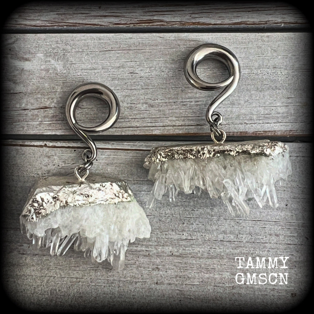 These gorgeous gauged earrings feature beautiful raw clear quartz pieces, measuring just under 7cms from tip to tip, and weighing approx 30 grams each.

This pair has been made on 2 gauge (6mm) surgical steel full curl hooks, suitable for stretched lobes.