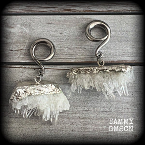 These gorgeous gauged earrings feature beautiful raw clear quartz pieces, measuring just under 7cms from tip to tip, and weighing approx 30 grams each.

This pair has been made on 2 gauge (6mm) surgical steel full curl hooks, suitable for stretched lobes.
