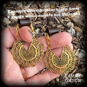 Featuring gorgeous antique gold lotus mandala charms, these earrings are nice and dangly, measuring just on 7cms from tip to tip, and nice and light weight at just 7 grams each piece.
This pair has been made with our super versatile antique gold chain and lobster clasp 4mm option, to be worn through silicone earlets or tunnels in stretched lobes from 6 gauge (4mm).