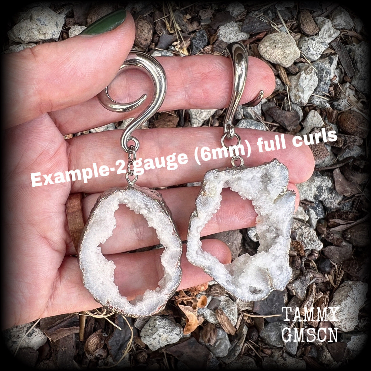 These gorgeous earrings feature a pair of unique one of a kind white druzy geodes, measuring just on 8cms from tip to tip, and weighing approx 15 grams each.
This pair of beautiful gauged earrings have been made on 2 gauge (6mm) surgical steel full curl hooks, to be worn in stretched lobes.