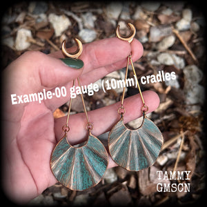 These earrings are simply beautiful, measuring just over 10cms from tip to tip, and are not too heavy at only 16 grams each.
This pair has been made on 00 gauge (10mm) surgical steel cradles, suitable for stretched lobes.
