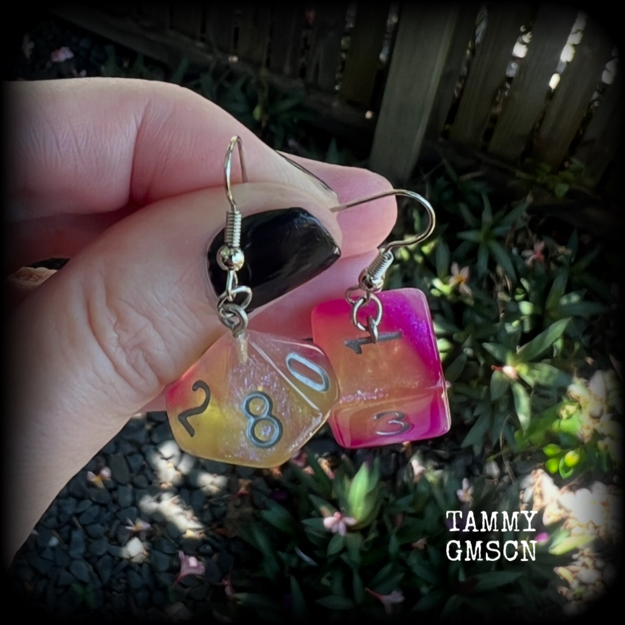 These fabulously geeky earrings feature a pair of mismatched peach and pink galaxy gaming dice, measuring approx 6cms from tip to tip and weighing only 6 grams each.

This pair have been made with stainless steel french hooks, suitable for pierced ears.