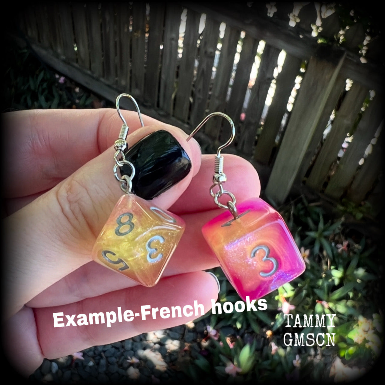 These fabulously geeky earrings feature a pair of mismatched peach and pink galaxy gaming dice, measuring approx 6cms from tip to tip and weighing only 6 grams each.

This pair have been made with stainless steel french hooks, suitable for pierced ears.