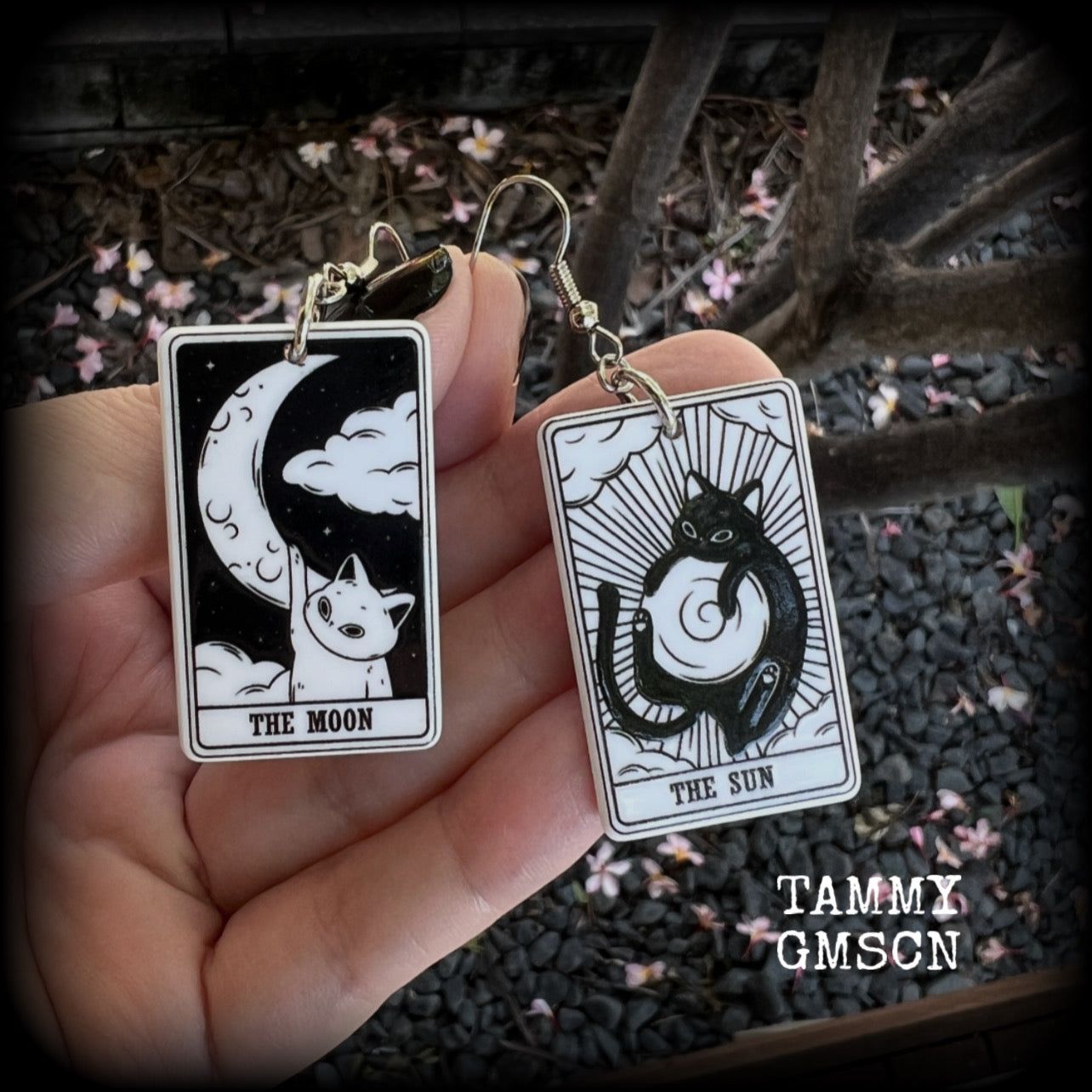 These adorable tarot card earrings feature The Sun and The Moon, black and white lightweight tarot card charms, weighing only a few grams each, and measure approx 5cms from tip to tip.

This pair has been made with stainless steel french hooks, for pierced ears.
