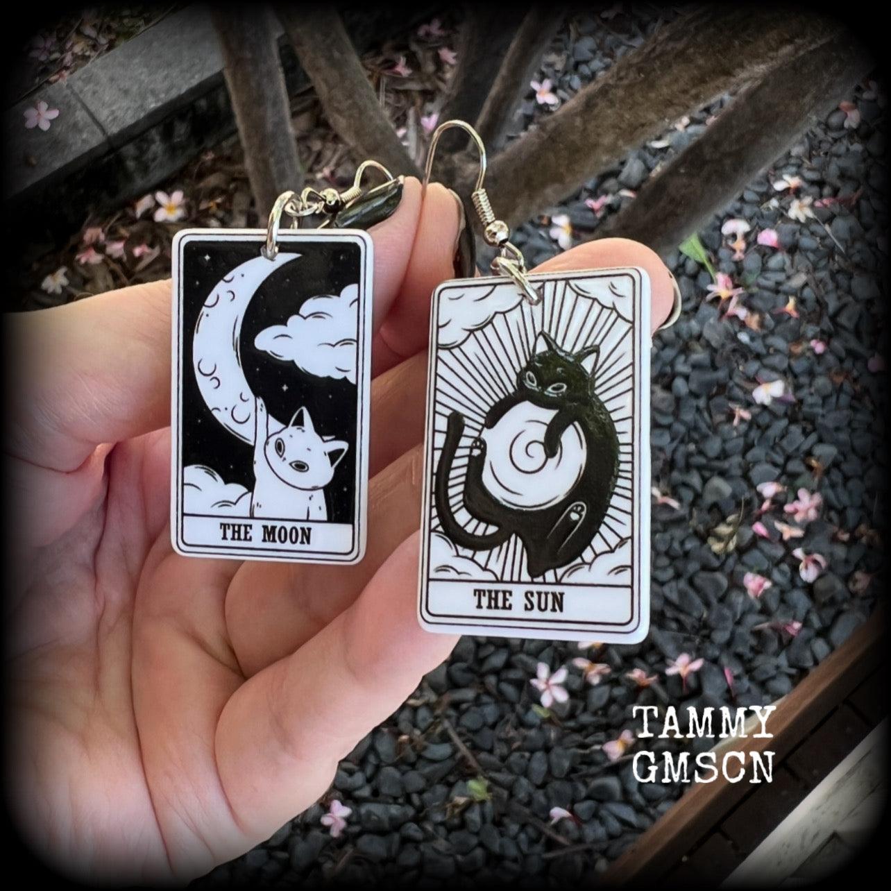 These adorable tarot card earrings feature The Sun and The Moon, black and white lightweight tarot card charms, weighing only a few grams each, and measure approx 5cms from tip to tip.

This pair has been made with stainless steel french hooks, for pierced ears.
