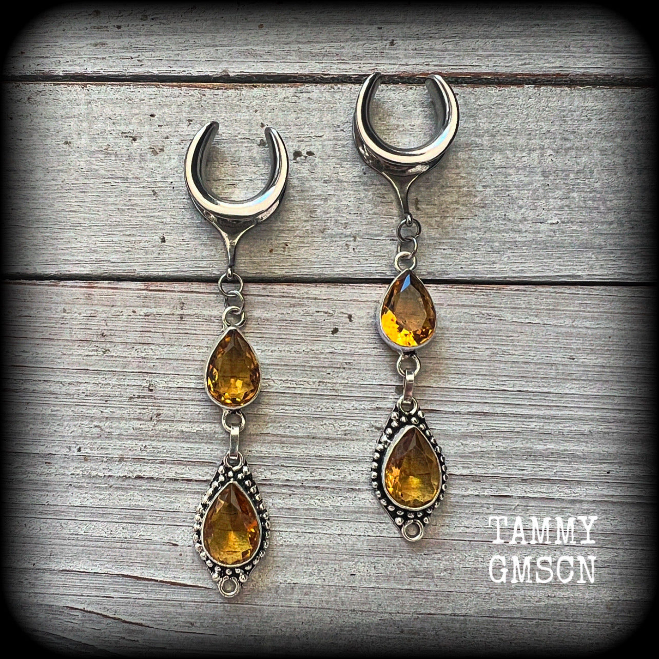 These beautiful boho gauged earrings have been made with gorgeous yellow citrine gemstones, lovely and dangly at approx 8.5cms from tip to tip, and weighing approx 9 grams each.

These earrings have been made on 5/8” gauge (16mm) surgical steel cradles, to be worn in stretched lobes.