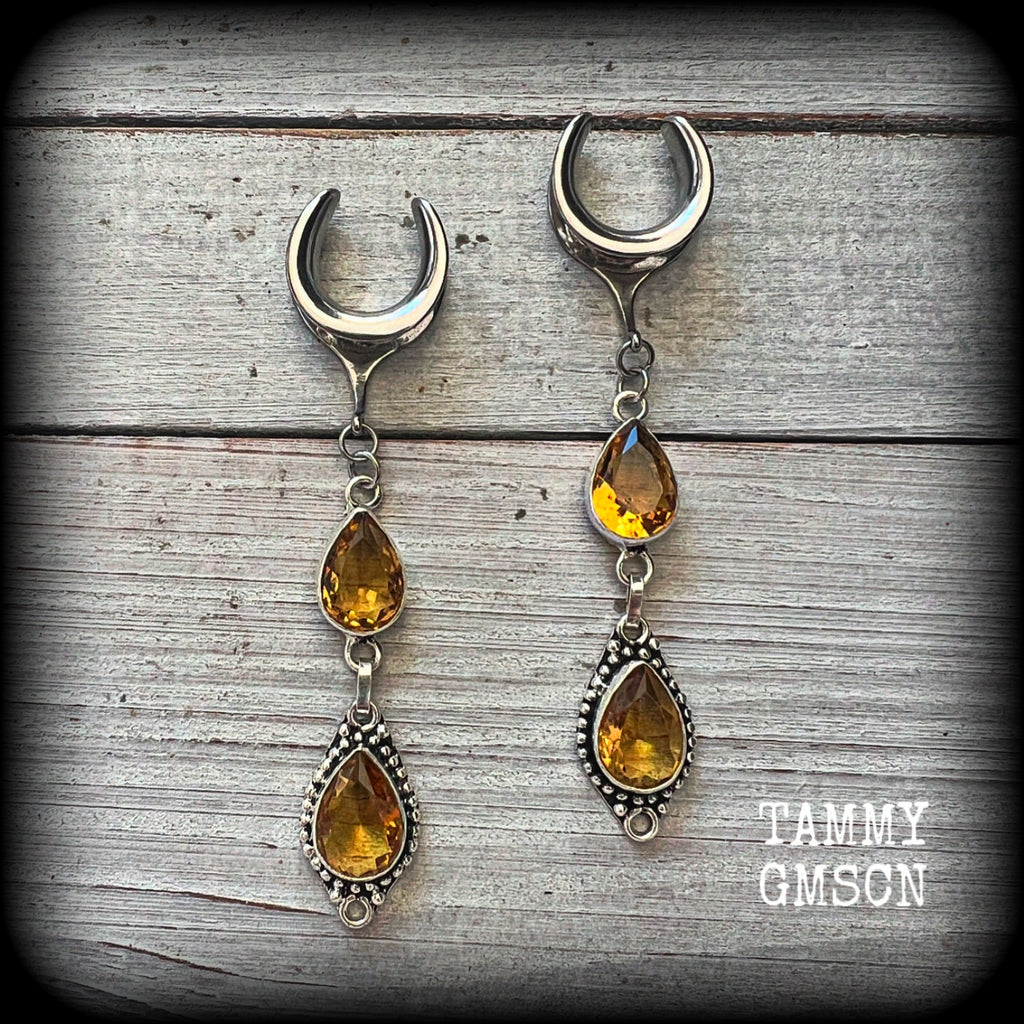 These beautiful boho gauged earrings have been made with gorgeous yellow citrine gemstones, lovely and dangly at approx 8.5cms from tip to tip, and weighing approx 9 grams each.

These earrings have been made on 5/8” gauge (16mm) surgical steel cradles, to be worn in stretched lobes.