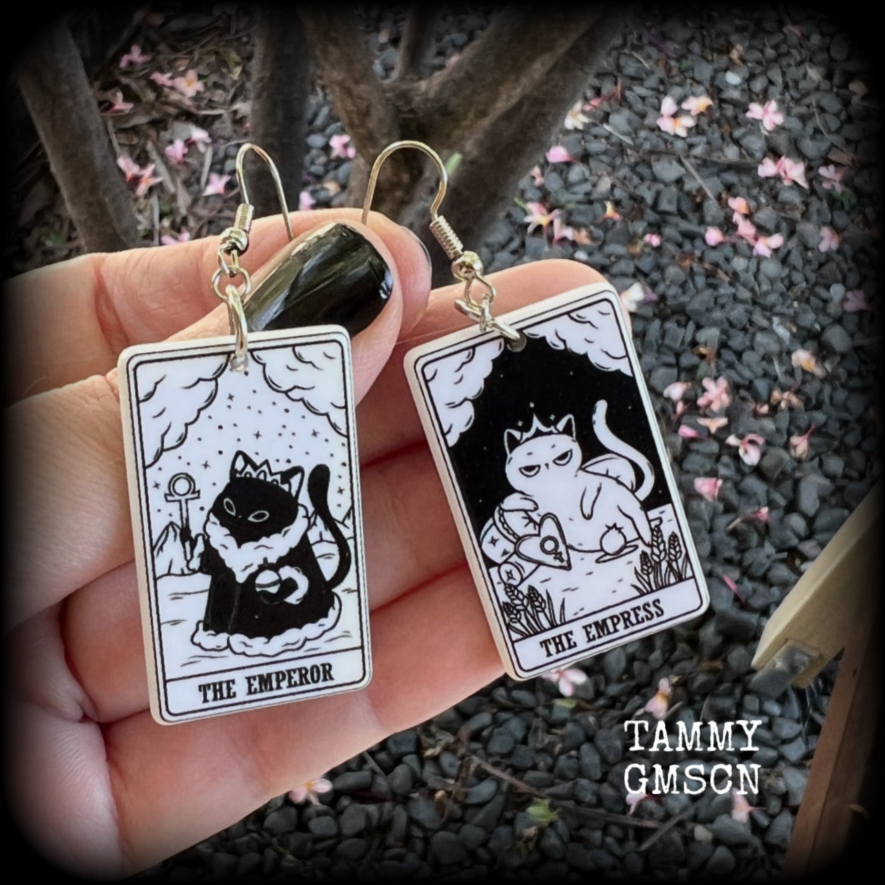These stunning cat tarot card earrings feature The Emperor and The Empress, black and white lightweight tarot card charms, weighing only a few grams each, and measure approx 5cms from tip to tip.

This pair has been made with stainless steel french hooks, for pierced ears.