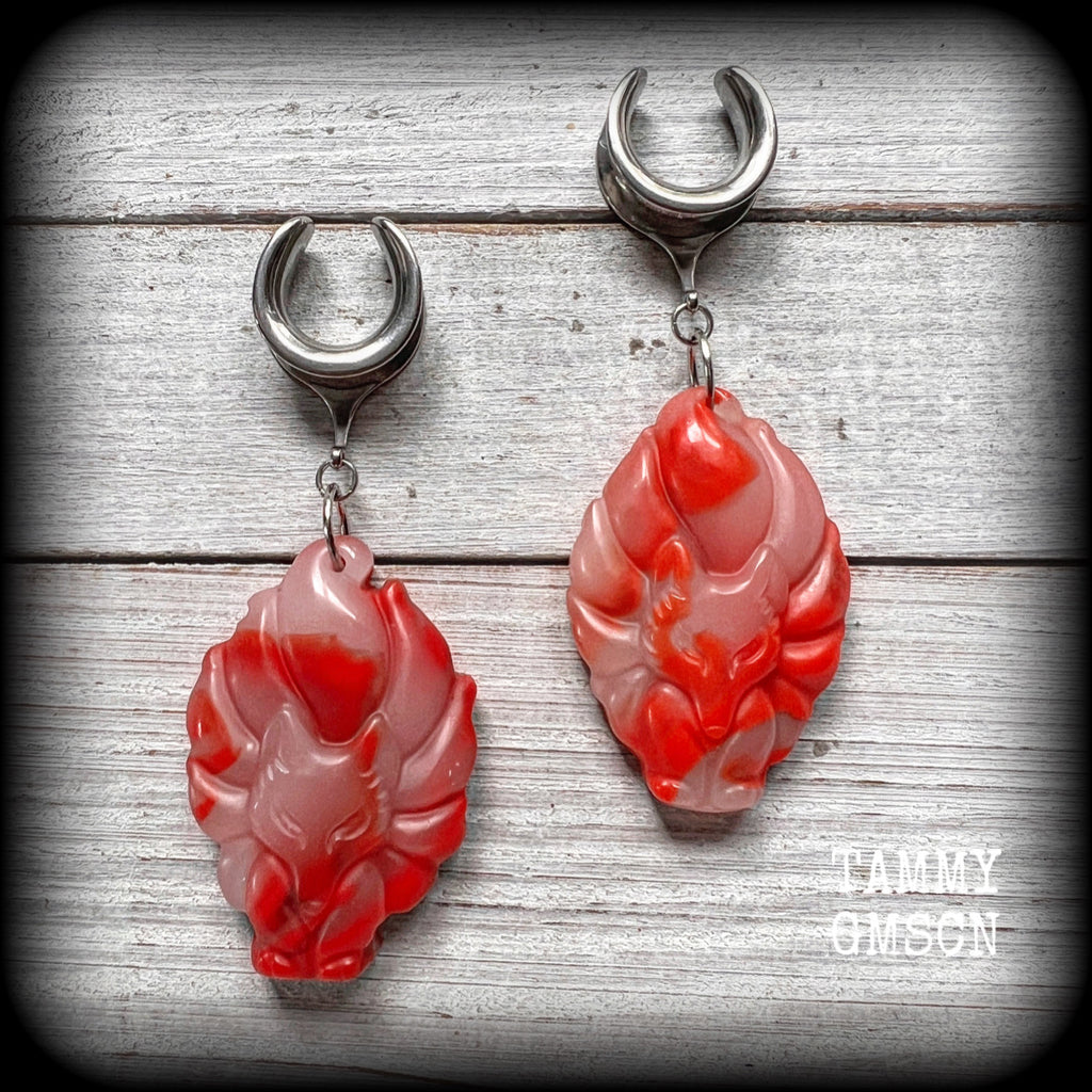 These gorgeous earrings feature carved Japanese jade kitsune, weighing approx. 25 grams each and measuring approx 8cms from tip to tip.
This pair have been made on 5/8” gauge (16mm) surgical steel cradles, suitable for stretched lobes.