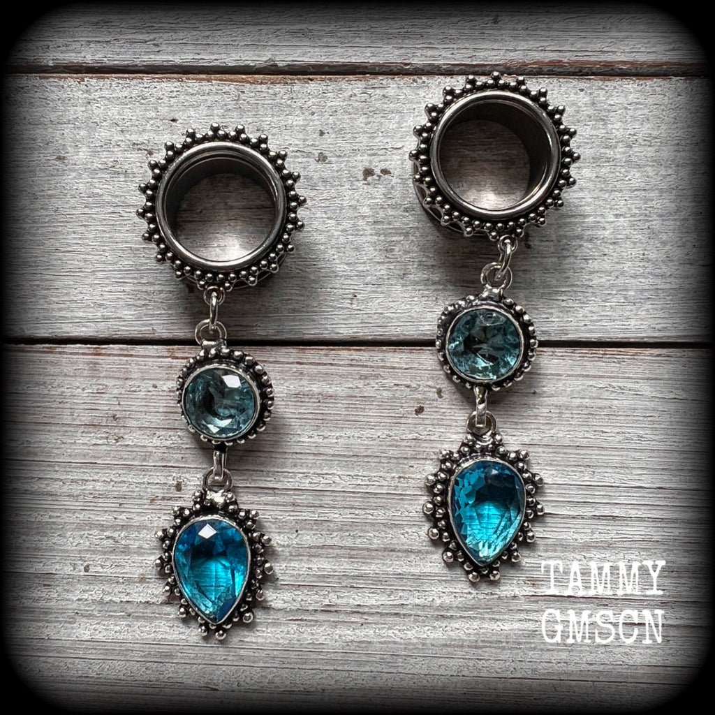 These gorgeous boho tunnel earrings have been made with beautiful ocean blue gemstones in an antique silver setting, are light weight-weighing approx 12 grams each and measure just on 7.5 cms from tip to tip.
These tunnel dangles have been made with 5/8” gauge (16mm) ornate stainless steel screw fit tunnels.