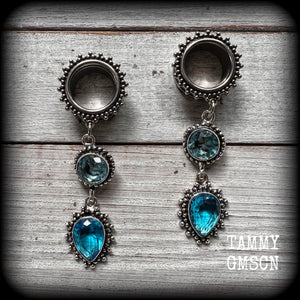 These gorgeous boho tunnel earrings have been made with beautiful ocean blue gemstones in an antique silver setting, are light weight-weighing approx 12 grams each and measure just on 7.5 cms from tip to tip.
These tunnel dangles have been made with 5/8” gauge (16mm) ornate stainless steel screw fit tunnels.