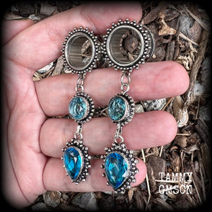 These gorgeous boho tunnel earrings have been made with beautiful ocean blue gemstones in an antique silver setting, are light weight-weighing approx 12 grams each and measure just on 7.5 cms from tip to tip.
These tunnel dangles have been made with 5/8” gauge (16mm) ornate stainless steel screw fit tunnels.