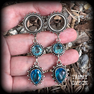 These gorgeous boho tunnel earrings have been made with beautiful ocean blue gemstones in an antique silver setting, are light weight-weighing approx 12 grams each and measure just on 7.5 cms from tip to tip.
These tunnel dangles have been made with 5/8” gauge (16mm) ornate stainless steel screw fit tunnels.