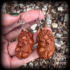 Featuring gorgeous carved peach wood Pixiu lions, these earrings are nice and lightweight, weighing only 6 grams each and measuring just on 7.5 from tip to tip.
This pair has been made on small antique silver shepard  hooks.
