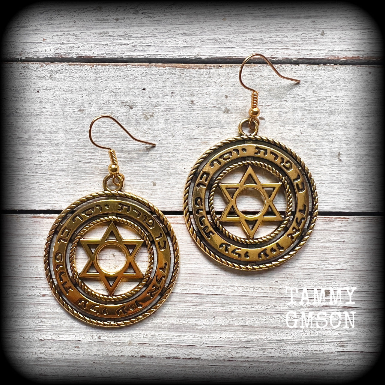 These gorgeous antique gold earrings feature the Star of David enclosed in the Shema Yisrael prayer. Measuring just on 8 grams a piece, these earrings are nice and dangly, measuring 6cms from tip to tip.

Made with antique gold french hooks.