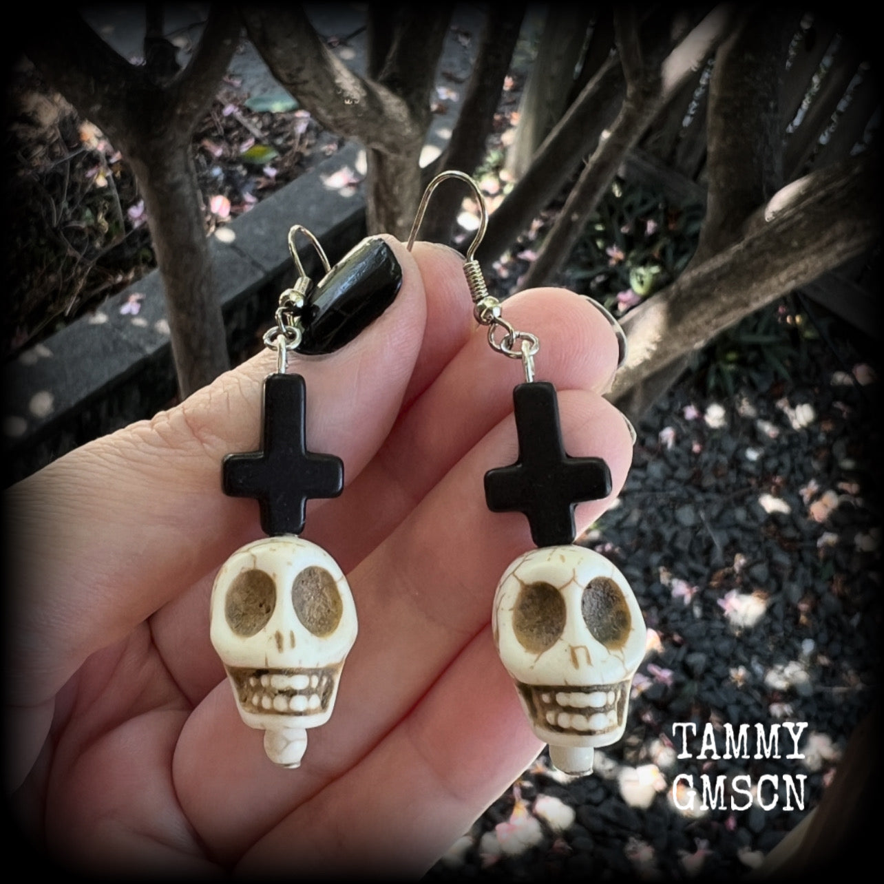 Inspired by Baron Samedi these earrings features pitch black inverted crosses with bone white skulls, measuring 7cms from tip to tip and weighing 7 grams a piece.

This pair have been made with stainless steel french hooks, suitable for pierced ears.