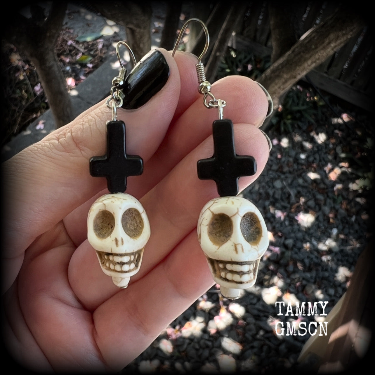 Inspired by Baron Samedi these earrings features pitch black inverted crosses with bone white skulls, measuring 7cms from tip to tip and weighing 7 grams a piece.

This pair have been made with stainless steel french hooks, suitable for pierced ears.